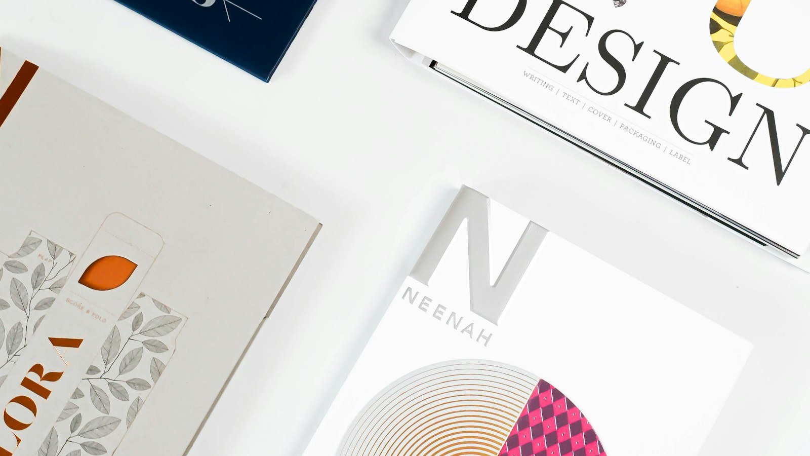Design books and paper samples arranged on a desk