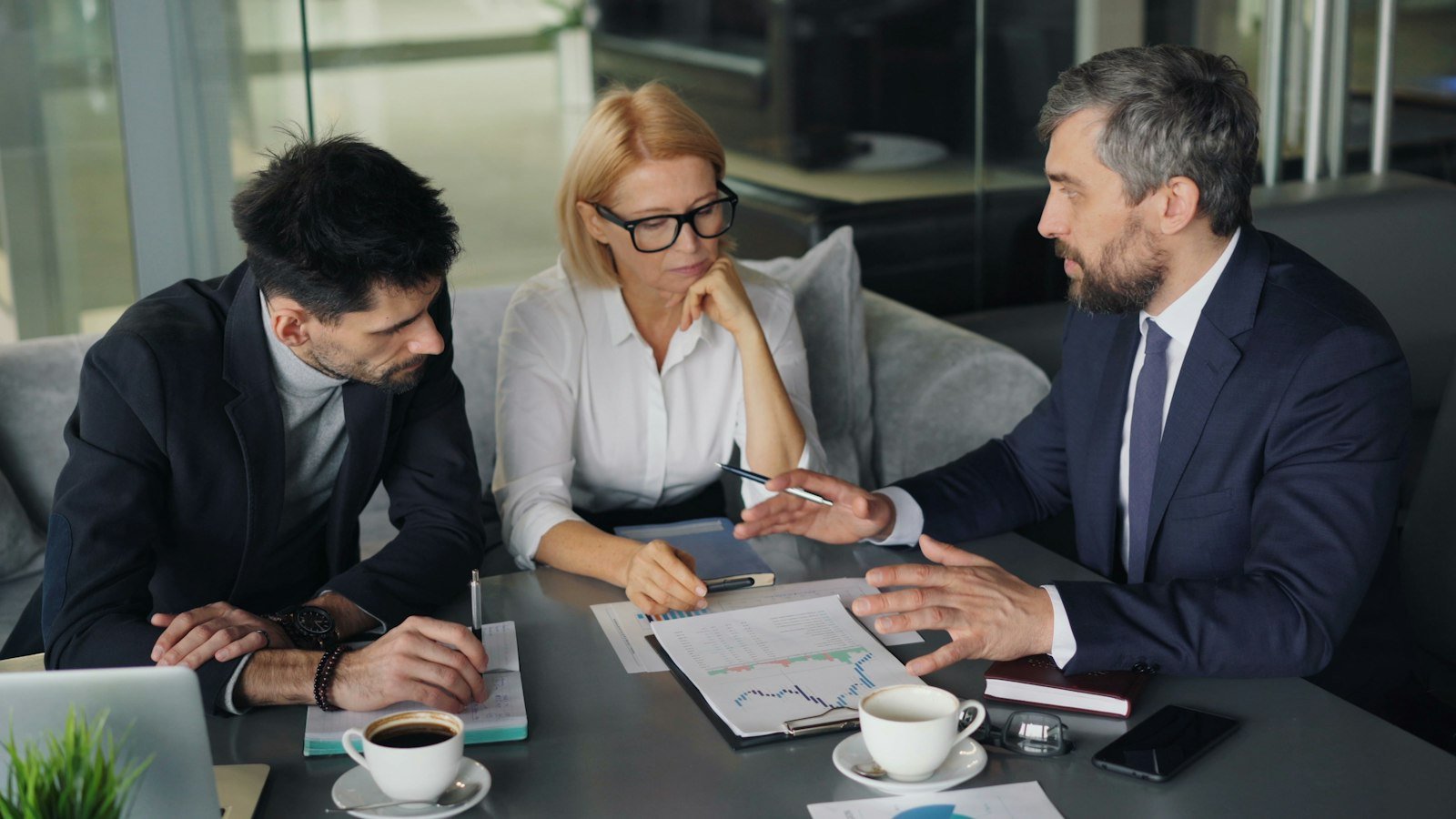 Business professionals reviewing documents together