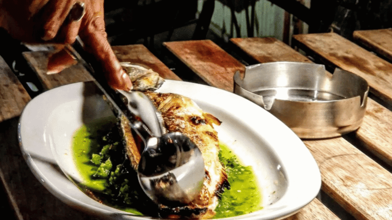 Chef plating a dish at Embers Kitchen